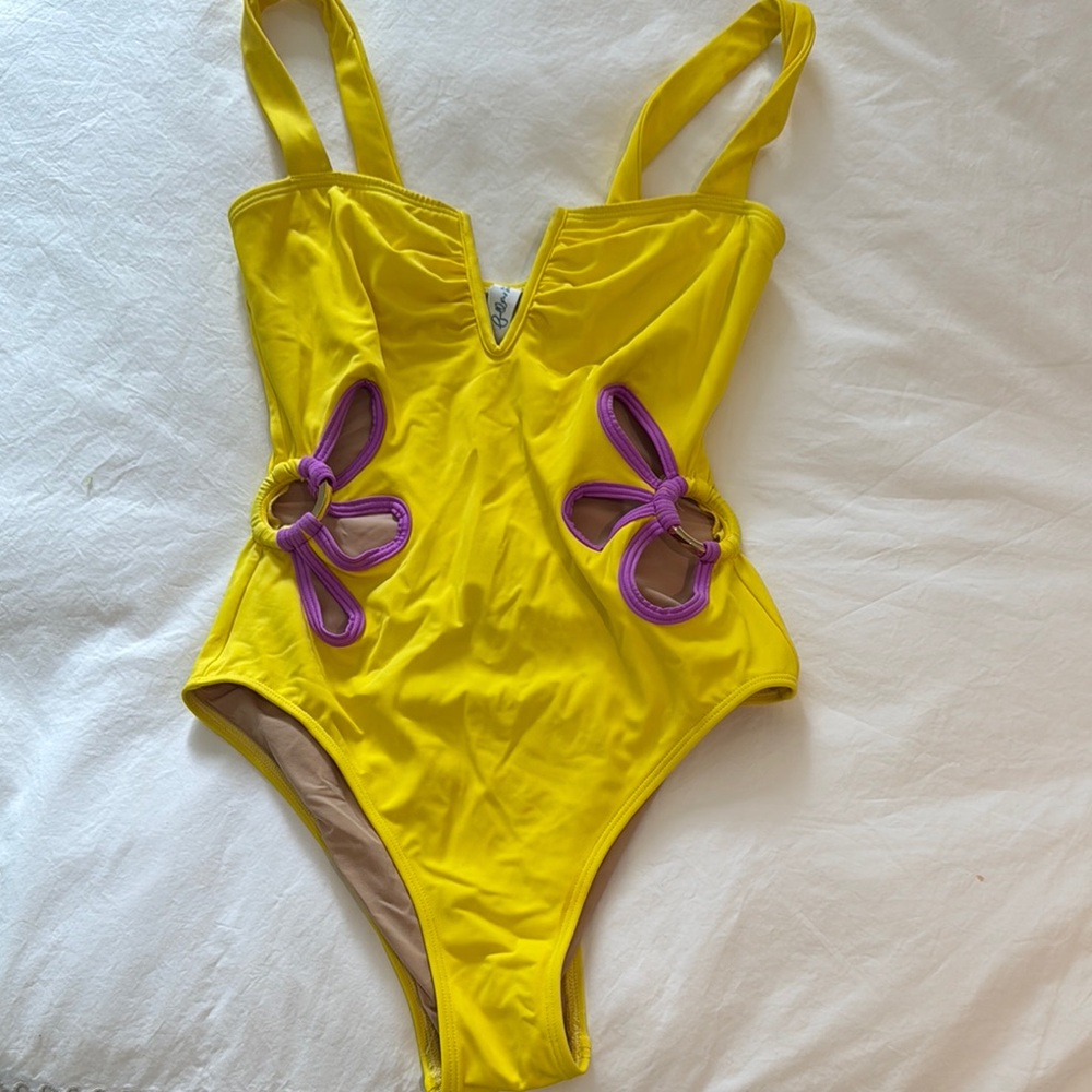 Stylish Yellow One-Piece Swimsuit with Purple Accents